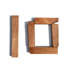 The number 10 is made of wood on a white background board