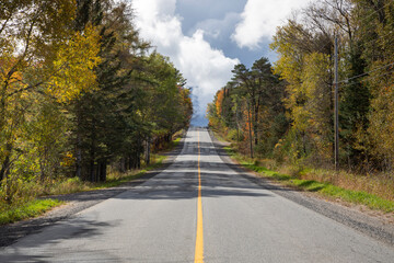 Stormy sky over a road through Muskoka in fall