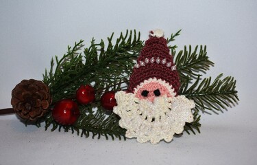 Hand crocheted Santa Claus face, Christmas decoration. 