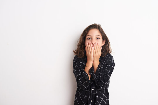 Child hiding her mouth