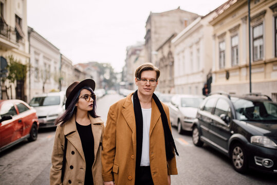 Young stylish couple walking on the street