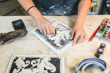 Artisan Woman Using Sandpaper on a Scagliola Artwork