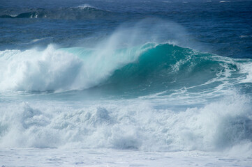 Waves breaking on the beach near the town of Carmel on the pacific coast  of California