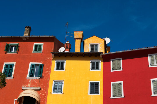 yellow, orange and red building and blue sky