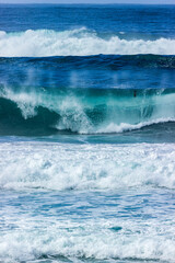 Waves breaking on the beach near the town of Carmel on the pacific coast  of California