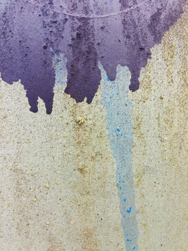 Close up dripping paint and graffiti on urban wall