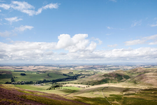 Green fields, blue skies