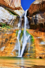 Fototapeta na wymiar Lower Calf Creek Falls Waterfall colorful views from the hiking trail Grand Staircase Escalante National Monument between Boulder and Escalante in Southern Utah. United States.