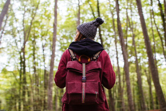 Woman in the forest with her backpack