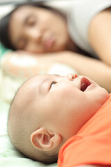 baby and mommy in the bed