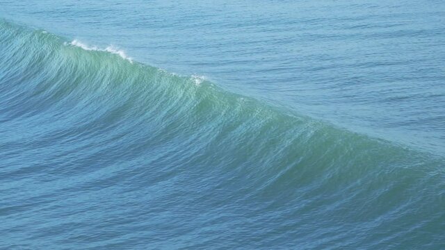 Beautiful ocean waves running, breaking and splashing, following shot