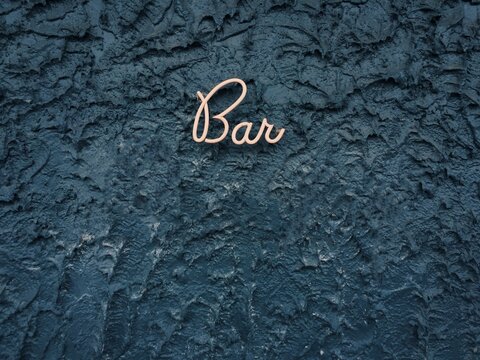 Beautiful 'Bar' Sign on Textured Wall