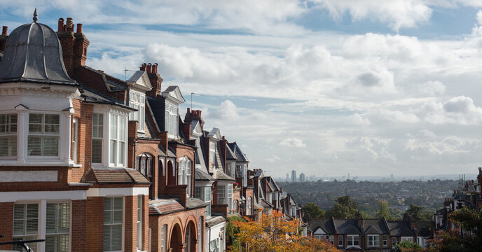 Brick houses of Muswell Hill and panorama of London with Canary Wharf, London, UK