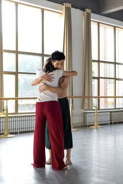 Young couple dancing in a studio