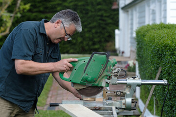 Workman using circular saw