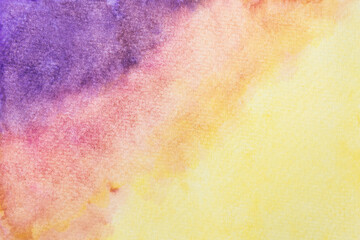 Watercolor painting on paper wallpaper. Hand painted purple, red and yellow watercolor background.
