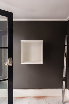 home renovation, hanging shelving system on the wall, the first