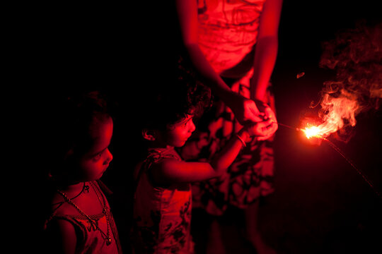 Kids and teenager enjoy and making fun with firecrackers