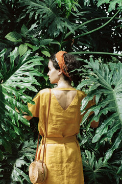 Woman standing in tropic forest