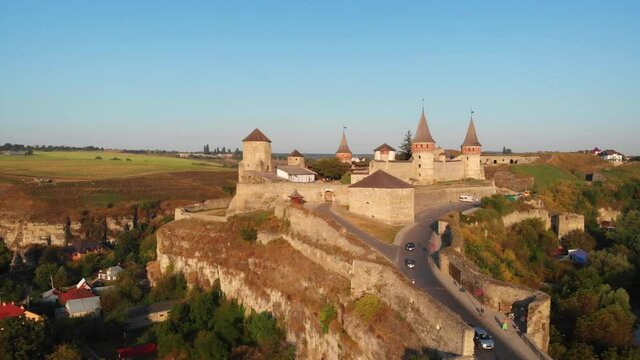 Tourists Departing Kamianets Podilskyi Castle along Paved Roadway