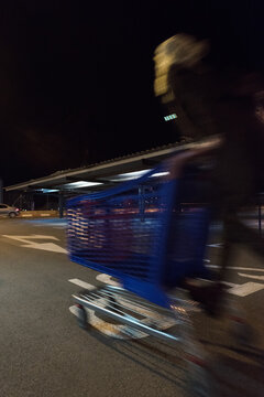 Girl riding a shopping cart