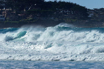 Waves breaking on the beach near the town of Carmel on the pacific coast  of California