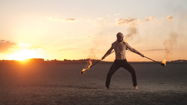Man Fire Juggling In The Desert