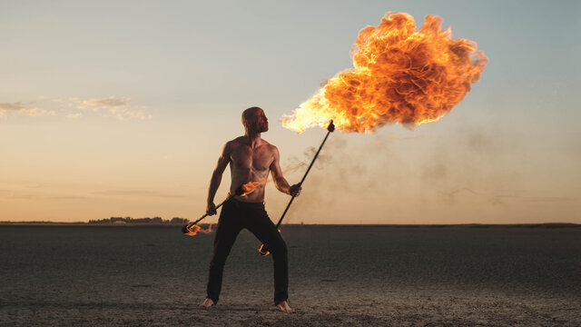 Acrobat Performing Spitting Fire Act