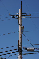 Upper part of an Electricity Distribution Pylon with cables and power lines