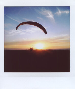 Paragliding at sunset.