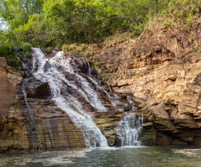 Naklejka premium waterfall view at Capitolio. One of the most popular tourism places in Minas Gerais near the Canastra mountain range. Boat ride attraction