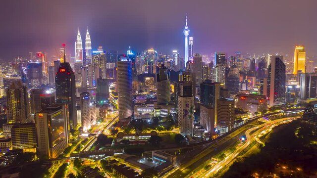 aerial view hyperlapse 4k video of Kuala Lumpur city center view during dawn overlooking the city skyline in Federal Territory, Malaysia. petronas twin towers hyper lapse.	

