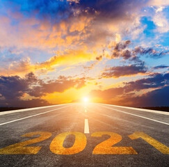 Empty asphalt roads and the New Year 2021 concept. The 2021 number on the straight highway.