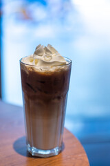 Iced coffee with whipped cream and sprinkle with almonds