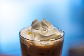 Iced coffee with whipped cream and sprinkle with almonds