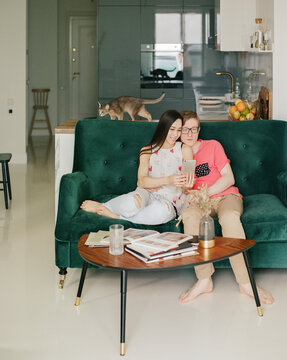 Couple sitting on sofa at home