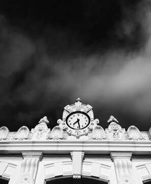 blak and white picture of a building clock