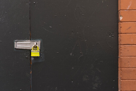 Padlock on warehouse door