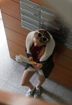 Woman sorting received correspondence