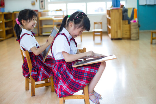 Two litte asian girl in the kindergarten