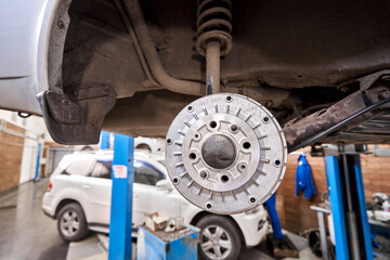Rusty drum brakes, rear on car. Change the old to new brake disc on car in a garage. Auto mechanic...