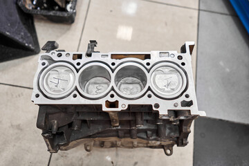 New pistons and cylinder head of engine block vehicle. Motor capital repair. Sixteen valve and four...