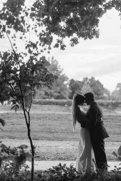 Black and White Portrait of a Wedding Couple Under a Tree