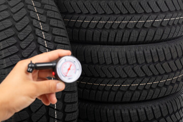 New tyre and mechanic's hand