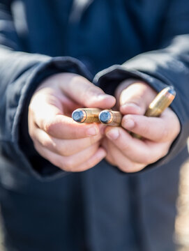 Kid holding bullets