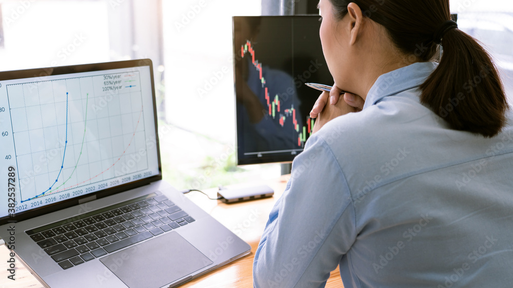 Poster stock exchange trader working with graphs,diagrams on monitor in modern trading office