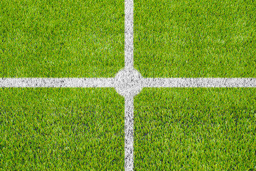 Top view of the white Line marking on the artificial green grass soccer field.
