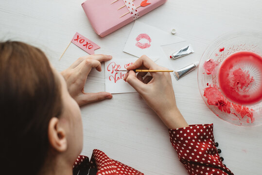 Woman Painting Romantic Cards For Valentine's Day