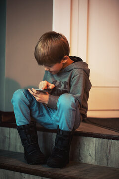 Boy playing using smartphone