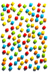 Candy.  Colorful candies are scattered randomly on a white background top view frame copy space. Chewing gum, and dragees are scattered.